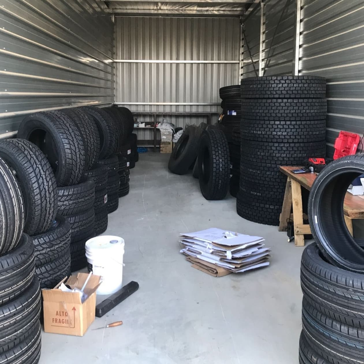 The original ALPHA Tyres setup — a ute, a trailer and a storage shed